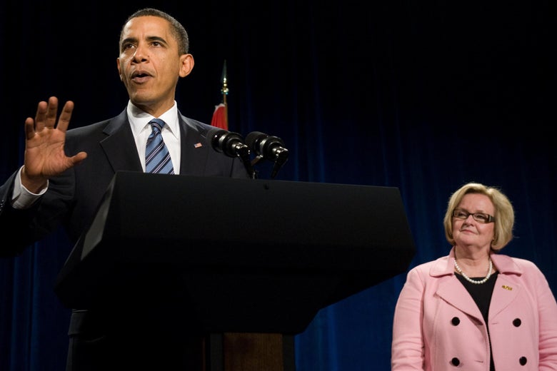 President Barack Obama speaks at a podium with Claire McCaskill to the right.